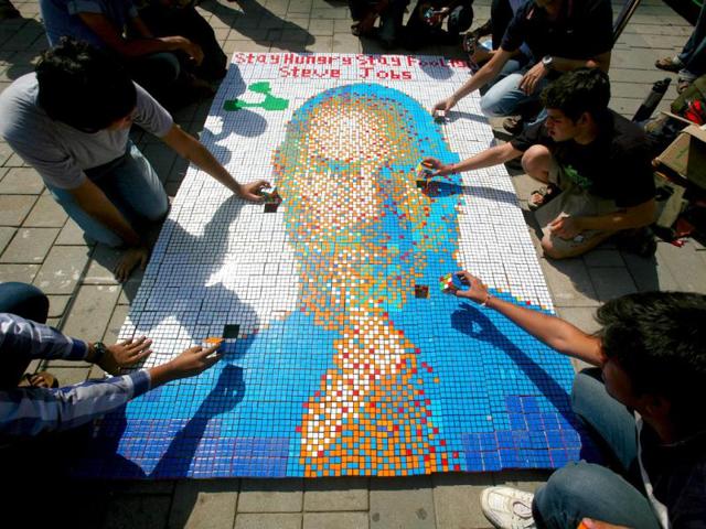 Students work on a picture of Steve Jobs at High Street Phoenix Courtyard as a part of Annual Techfest 'Technovanza 2012'. HT Photo/Kalpak Pathak