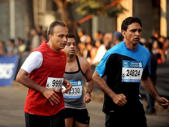 Anil Ambani runs during the Standard Chartered Mumbai Marathon 2012, in Mumbai. AFP PHOTO/Punit Paranjpe
