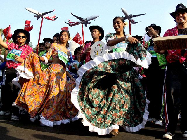 People in fancy dress participate in the dream run during the Standard Chartered Mumbai Marathon 2012 in Mumbai. PTI Photo/ Mitesh Bhuvad