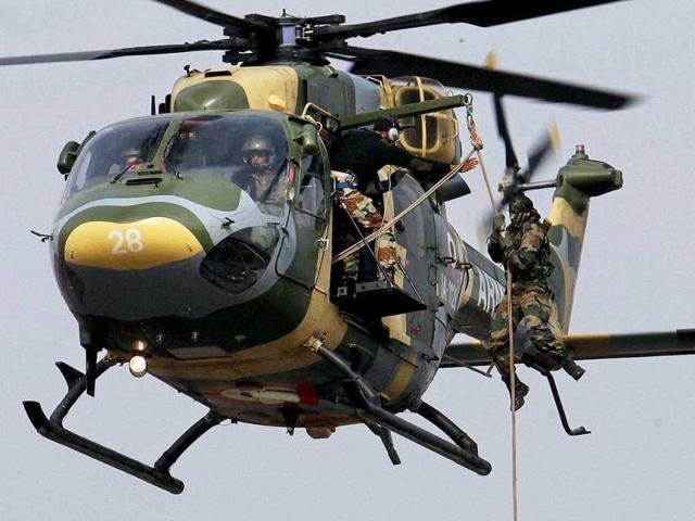 Army jawans show their war skills during the Army Day parade at Delhi Cantt in New Delhi. PTI Photo/Atul Yadav.
