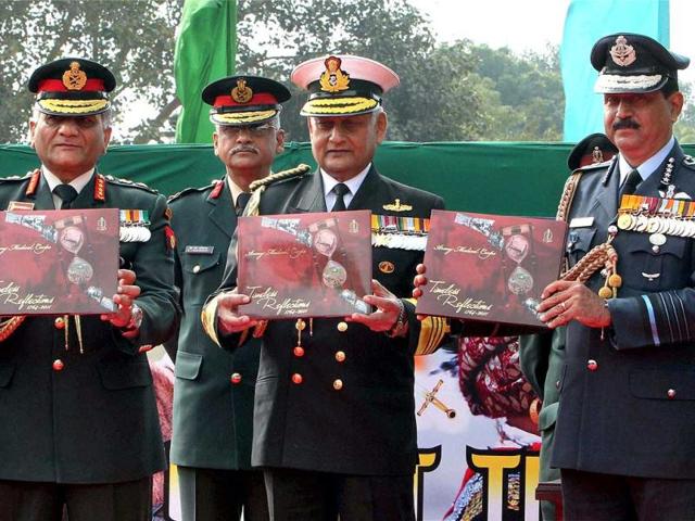 Army Chief General VK Singh (L), Navy Chief Admiral Nirmal Verma (C) and Air Chief Marshal NAK Browne, Chief of Air Staff, release a book after Army Day Parade in New Delhi. PTI Photo/Atul Yadav.