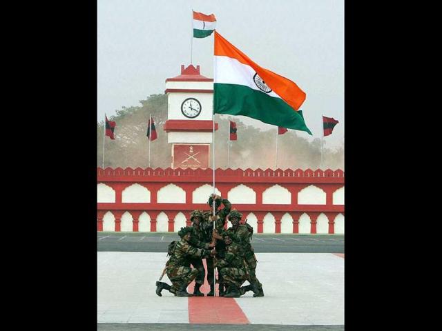 Army soldiers hold a Tricolour at a ceremony on the occasion of Army Day in New Delhi. PTI Photo/Atul Yadav.