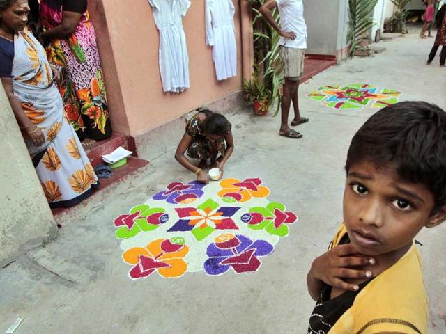 Sri Lankan ethnic Tamil Hindus decorate their houses during the Thai Pongal, a harvest festival traditionally celebrated by Tamils and dedicated to the Sun God, in Colombo, Sri Lanka. AP Photo