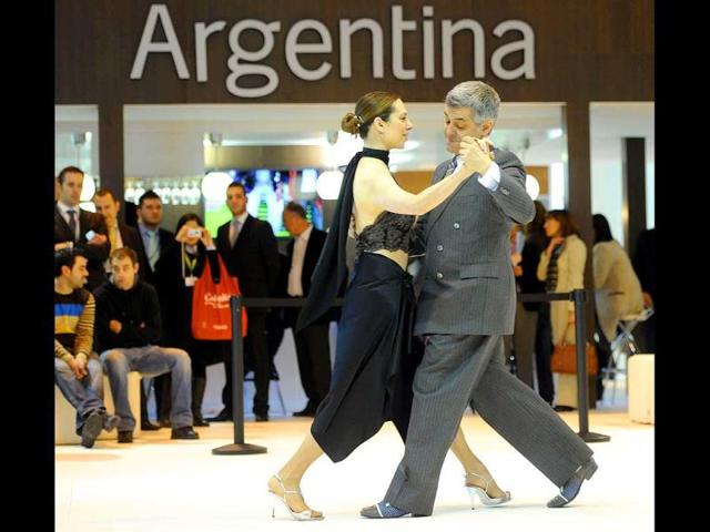 Tango dancers perform in front of the Argentinian stand during the inauguration of the International Tourism Trade Fair in Madrid. AFP photo