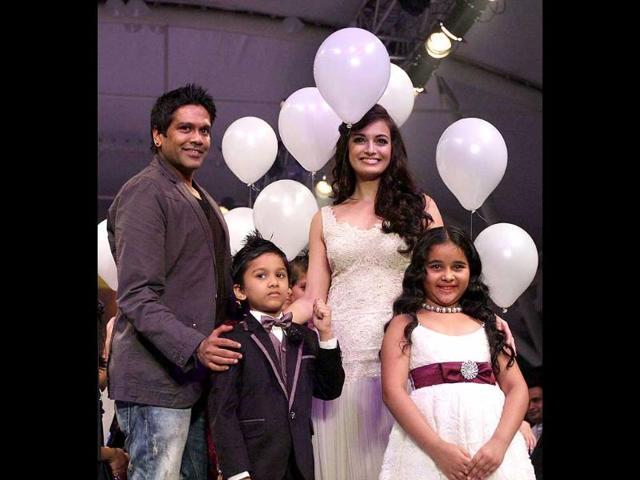 Bollywood actress Dia Mirza along with designer Rocky S and kids strikes a pose during the India Kids Fashion Week 2012, in Mumbai.