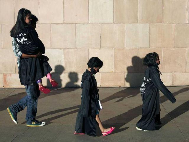 Child models walk towards the green room before a show at India Kids Fashion Week in Mumbai. Reuters/Danish Siddiqui.