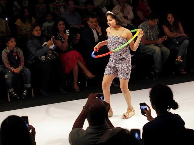 A child model displays a creation during a show at India Kids Fashion Week in Mumbai. Reuters/Danish Siddiqui.