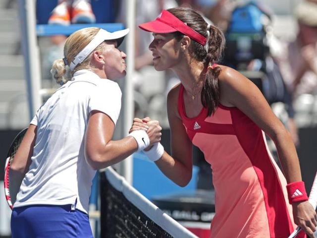 Serbia's Ana Ivanovic, right, and Michaella Krajicek of the Netherland's exchange kisses at the net following their second round match at the Australian Open tennis championship, in Melbourne, Australia. (AP Photo)