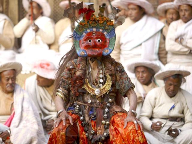 A medium performs a traditional mask dance during the Shikali festival in Lalitpur. Mediums wearing colourful clay masks participate in dances and people offer sacrificed animals and prayers in hope of gaining blessing from the deities during the Shikali festival. REUTERS/Navesh Chitrakar