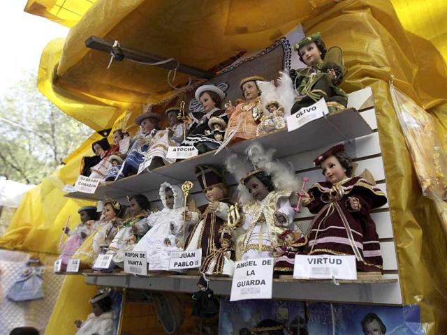 Dolls representing baby Jesus, dressed in traditional Mexican clothing, are displayed by a street vendor for the "Candelaria Day" celebration in Mexico City. Reuters/Henry Romero
