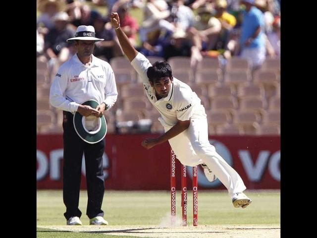 Zaheer Khan bowls and takes the wicket of David Warner during the first day of the fourth test cricket match against Australia in Adelaide. Reuters/Brandon Malone.