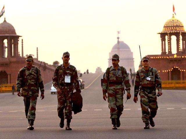 Security personnel patrol at Vijay Chowk on the eve of the 63rd Republic Day in New Delhi. PTI Photo by Kamal Singh