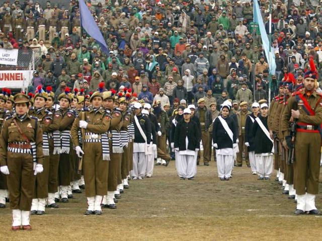 People watch police contingents perform a salute during Republic Day celebrations in Srinagar. Reuters photo/Fayaz Kabli
