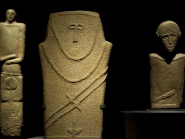 Three Anthropomorphic Steles carved from sandstone and dating back to the 3rd to 4th millenium BC are on display during a press preview of the Roads of Arabia exhibition at Berlin's Pergamon museum. The Roads of Arabia is the first-ever comprehensive international exhibition of Saudi Arabia’s historical artifacts, from 6.000 BC to the birth of the Saudi kingdom in 1932. AFP Photo/John Macdougall