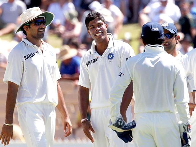 Umesh Yadav with teamates after taking the wicket of Michael Clarke on day 4 of the fourth cricket Test match in the Border-Gavaskar Trophy Series at the Adelaide. AFP