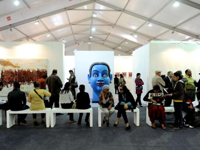 Visitors-look-at-a-works-of-art-at-the-India-Art-Fair-in-New-Delhi-AFP-Photo-Sajjad-Hussain