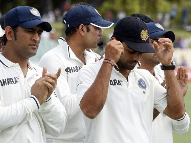 MS Dhoni (L) and Virat Kohli (3rd R) attend the trophy presesentation after Australia won the fourth cricket Test match against India making a clean sweep of the Border-Gavaskar Trophy Series at the Adelaide. AFP Photo/Tony Ashby