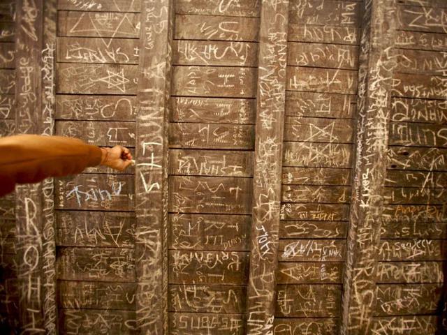 A hand of a devotee is seen as he writes on the ceiling of the Saraswati temple during the Shreepanchami festival in Kathmandu. Reuters/Navesh Chitrakar