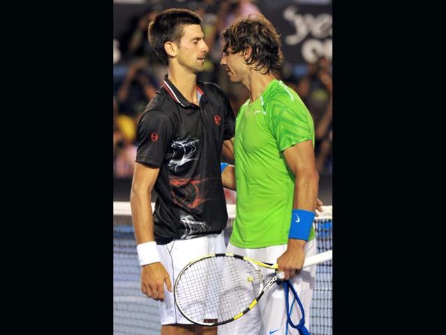 Novak-Djokovic-of-Serbia-consoles-Rafael-Nadal-of-Spain-at-the-net-after-the-men-s-final-match-at-Australian-Open-in-Melbourne-AFP-photo-Paul-Crock