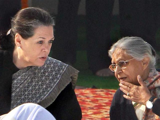 Congress President Sonia Gandhi and Delhi CM Sheila Dikshit at a prayer session on death anniversary of Mahatma Gandhi, observed as Martyrs' Day, at Rajghat in New Delhi. PTI Photo by Shahbaz Khan
