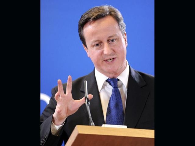 British Prime Minister David Cameron gestures while speaking during a media conference after an EU summit in Brussels. European leaders will try to come up with ways to boost growth despite steep budget cuts across the continent when they meet in Brussels on Monday. The 27 heads of state and government will get a taste of the popular frustration with austerity and high unemployment as they try to get to the summit in a city paralyzed by strikes. AP Photo/Geert Vanden Wijngaert