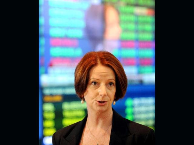 Australia's Prime Minister Julia Gillard holds a press conference after a briefing with central bank governor Glenn Stevens at the Australian Stock Exchange (ASX) in Sydney. Gillard announced she was determined the bring the national budget back to surplus, flagging cutbacks even as the country enjoys a huge mining boom. AFP PHOTO / Torsten Blackwood