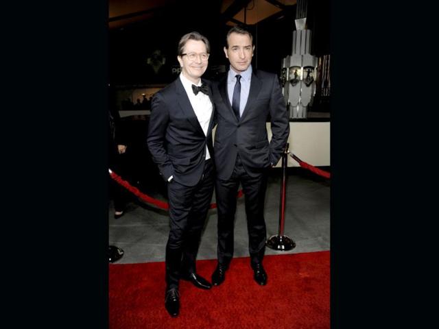 Academy Award nominated actors Gary Oldman and Jean Dujardin (R) pose together. Academy Award nominated actors Gary Oldman and Jean Dujardin (R) pose together.
