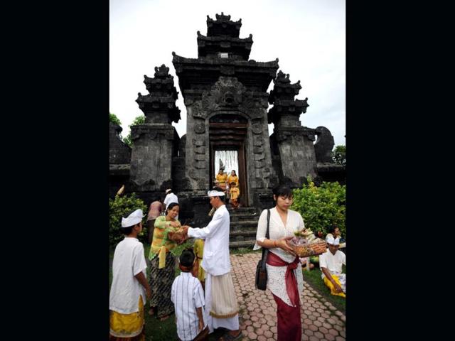 Balinese Hindus carry offerings as they celebrate the religious festival of Galungan at Jagatnatha temple in Singaraja, on the Hindu majority island of Bali. Galungan, based on the Hindu saka calendar, is the most important festival in Bali and symbolizes the victory of Virtue (Dharma) upon Evil (Adharma). AFP Photo /Sonny Tumbelaka