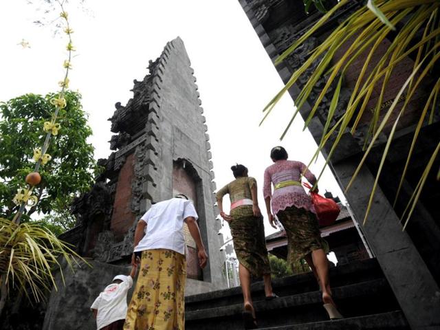 Balinese Hindus arrive to celebrate the religious festival of Galungan at Jagatnatha temple in Singaraja, on the Hindu majority island of Bali. Galungan, based on the Hindu saka calendar, is the most important festival in Bali and symbolizes the victory of Virtue (Dharma) upon Evil (Adharma). AFP Photo /Sonny Tumbelaka