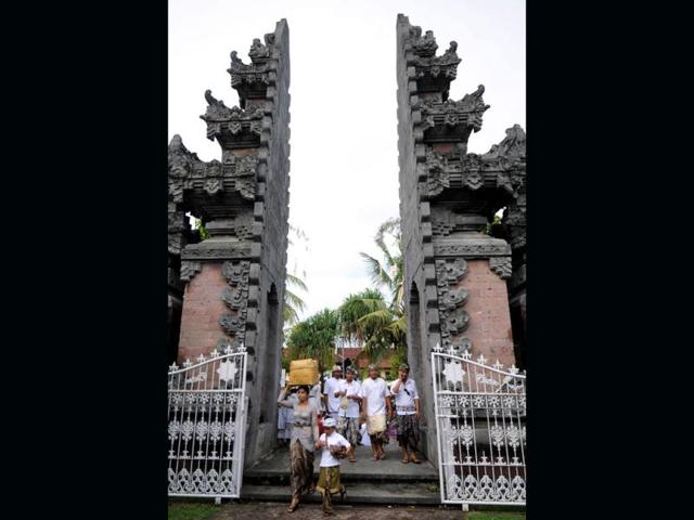 Balinese Hindus arrive to celebrate the religious festival of Galungan at Jagatnatha temple in Singaraja, on the Hindu majority island of Bali. Galungan, based on the Hindu saka calendar, is the most important festival in Bali and symbolizes the victory of Virtue (Dharma) upon Evil (Adharma). AFP Photo /Sonny Tumbelaka