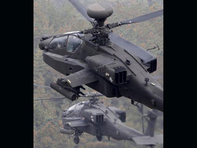In 2009 India invited bids for 22 combat helicopters and 15 heavy lift helicopters. Russia's Mil Moscow Helicopter plant and US Boeing submitted bids for the combat helicopters. In this file photo, US AH-64 Apache helicopters take part in an aerial gunnery training exercise in Pocheon.