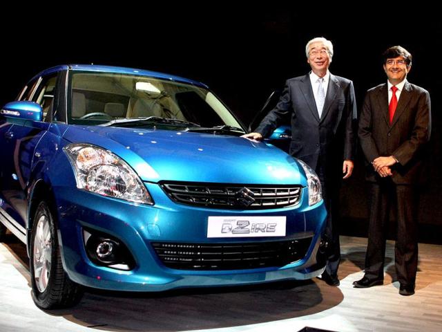 Shinzo Nakanishi (L), managing director & CEO, Maruti Suzuki India Limited, and Mayank Pareek, managing executive officer (sales & marketing), at the unveiling of new Maruti Swift DZire in New Delhi. PTI /Vijay Kumar Joshi