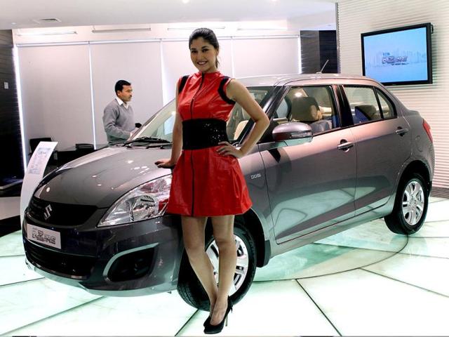 A model poses with the newly unveiled Swift DZire in New Delhi. HT/Sunil Saxena