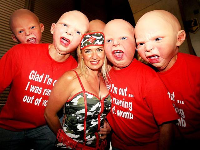 Sevens fans pose during the Rugby Sevens tournament in Wellington. AFP PHOTO /MARTY MELVILLE