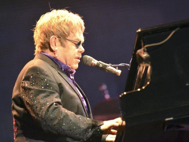British pop star Elton John performs during his latest concert tour at the Ricardo Saprissa Stadium in San Jose. Reuters/Kent Gilbert