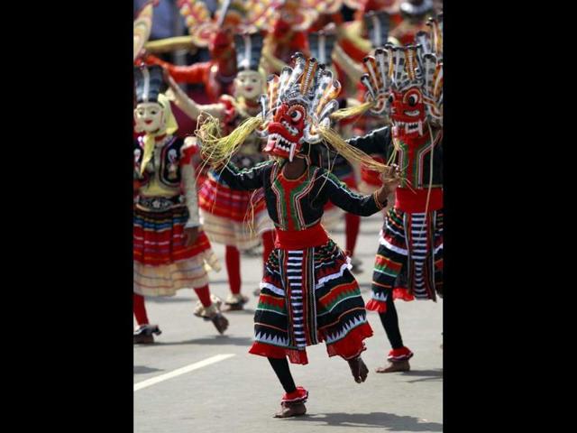 A dancer performs during a parade celebrating Sri Lanka's 64th Independence Day in Anuradhapura. AP