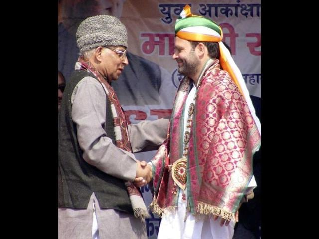 Congress general secretary Rahul Gandhi is presented a shawl during an election campaign rally in Varanasi. PTI Photo