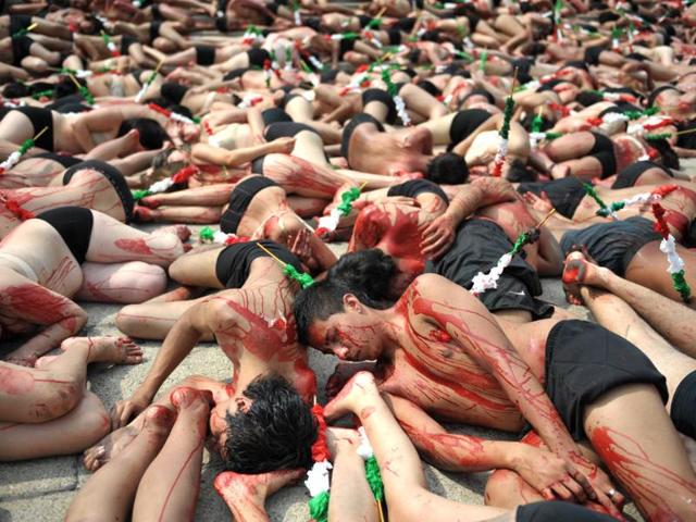 Members of the international organisation Animanaturalis take part in a protest against bullfighting at the Angel de la Independencia monument in Mexico City. AFP/Johan Ordonez
