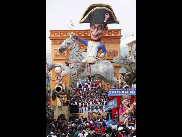 A carnival float called "Grandeur" showing French president Nicolas Sarkozy dressed as Napoleon on a horse sat on cannons (not pictured) parade during the carnival in Viareggio. AFP PHOTO/Fabio Muzzi