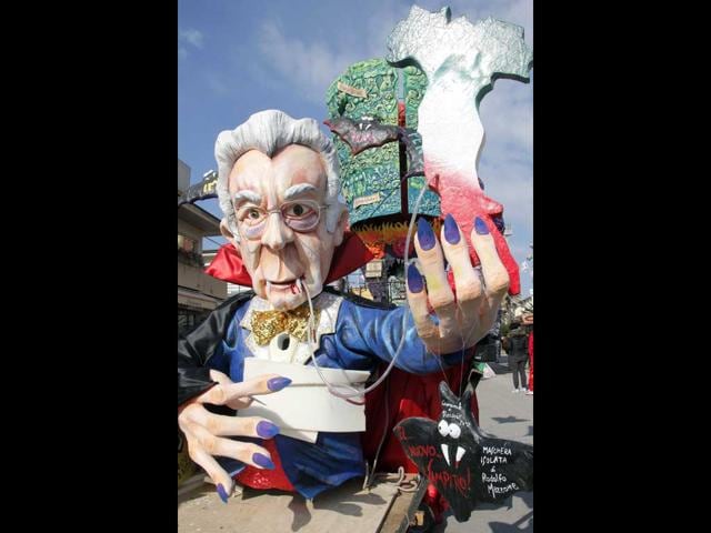 A carnival float showing Italian prime minister Mario Monti as a vampire parades during the carnival in Viareggio . AFP PHOTO/Fabio Muzzi