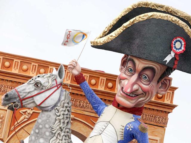 A carnival float called "Grandeur" showing French president Nicolas Sarkozy dressed as Napoleon on a horse sat on cannons (not pictured) parade during the carnival in Viareggio. AFP PHOTO/Fabio Muzzi