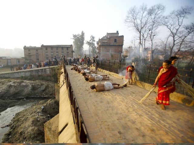 Devotees offer prayer by rolling on the street of Bhaktapur, near Kathmandu. The month-long Swasthani festival, dedicated to God Madhavnarayan and Goddess Swasthani, involves the recitation of folk tales about miraculous feats performed by them in many households.Reuters Photo/Navesh Chitrakar