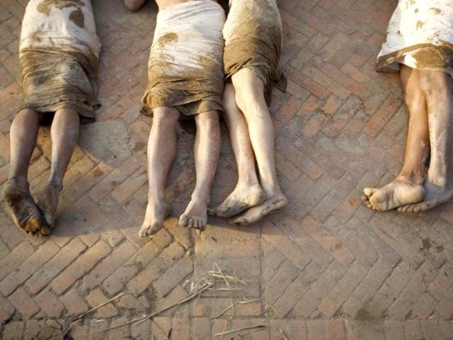 The feet of devotees are pictured while as they offer prayers by rolling on the street of Bhaktapur, near Kathmandu. The month-long Swasthani festival, dedicated to God Madhavnarayan and Goddess Swasthani, involves the recitation of folk tales about miraculous feats performed by them in many households. Reuters Photo/Navesh Chitrakar