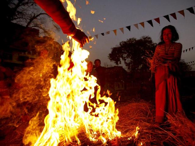 Devotees warm themselves by a fire after taking a dip on the final day of the month-long Swasthani festival in the Hanumante River at Bhaktapur, near Kathmandu. The month-long festival, dedicated to God Madhavnarayan and Goddess Swasthani, involves the recitation of folk tales about miraculous feats performed by them in many households. Reuters Photo/Navesh Chitrakar