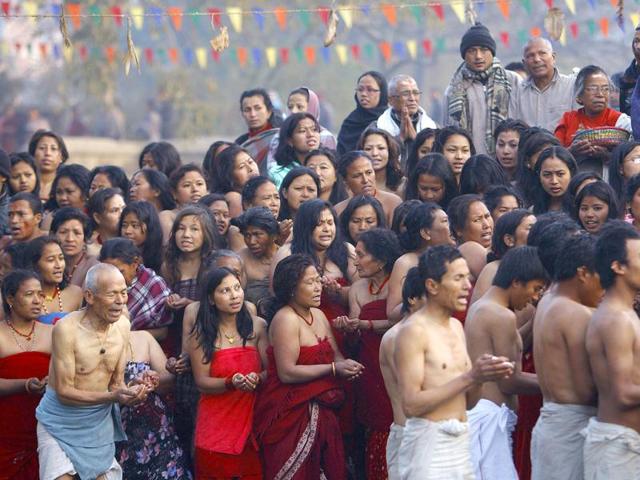 Devotees wait to take a holy bath at the Hanumante River during the Swasthani festival in Bhaktapur near Kathmandu. The month-long festival, dedicated to God Madhavnarayan and Goddess Swasthani, involves the recitation of folk tales about miraculous feats performed by them in many households. Reuters Photo/Navesh Chitrakar