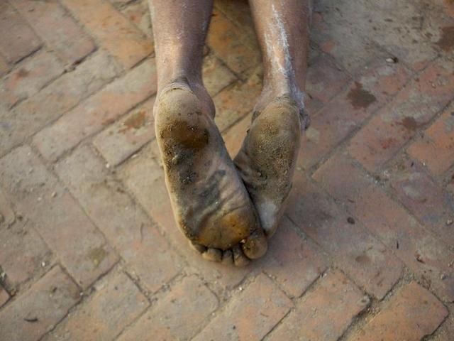 The feet of a devotee is pictured as he offers prayer by rolling on the street of Bhaktapur, near Kathmandu. The month-long festival, dedicated to God Madhavnarayan and Goddess Swasthani, involves the recitation of folk tales about miraculous feats performed by them in many households. Reuters Photo/Navesh Chitrakar