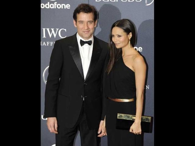 Actors-Clive-Owen-and-Thandie-Newton-pose-for-photographs-as-they-arrive-for-the-Laureus-World-Sports-Awards-2012-in-central-London-Reuters-Paul-Hackett