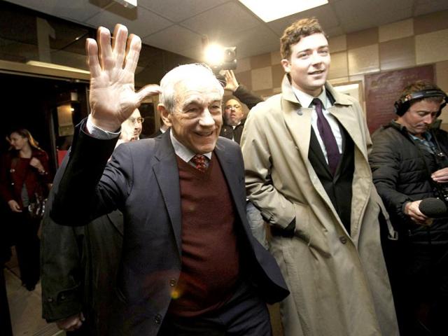 US Republican presidential candidate Rep Ron Paul (R-TX) waves as he arrives at a caucus site at the Coon Rapids Middle School on the night of the Minnesota Republican Caucuses in Coon Rapids, Minnesota. Reuters