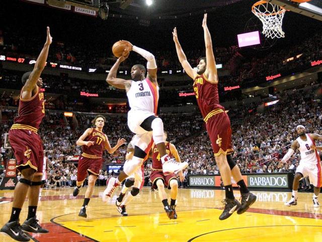 Dwyane Wade #3 of the Miami Heat drives against Omri Casspi #36 of the Cleveland Cavaliers during a game at American Airlines Arena in Miami, Florida. AFP