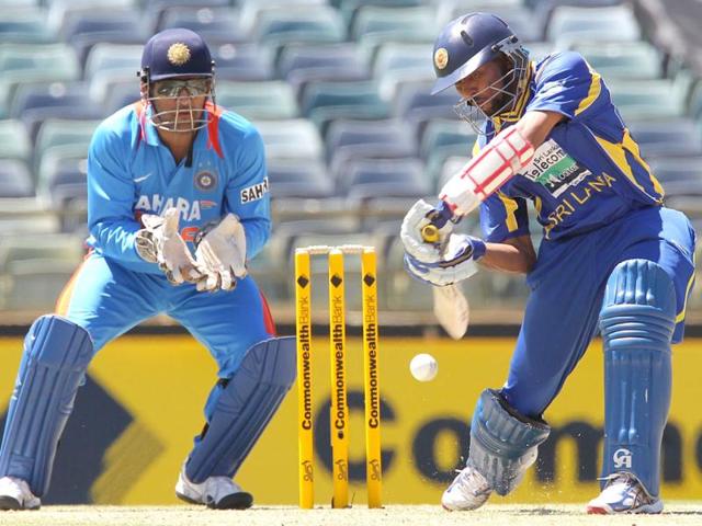 Tillakaratne-Dilshan-hits-to-the-boundary-watched-by-MS-Dhoni-during-the-match-against-India-in-the-Tri-Nations-ODI-cricket-series-at-the-WACA-ground-in-Perth-AFP Tillakaratne-Dilshan-hits-to-the-boundary-watched-by-MS-Dhoni-during-the-match-against-India-in-the-Tri-Nations-ODI-cricket-series-at-the-WACA-ground-in-Perth-AFP